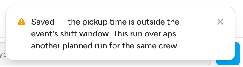 Screenshot: A warning toast reading "Added — this run overlaps another planned run for the same crew." shown after saving a planned job, in the amber/warning style rather than the usual green success style